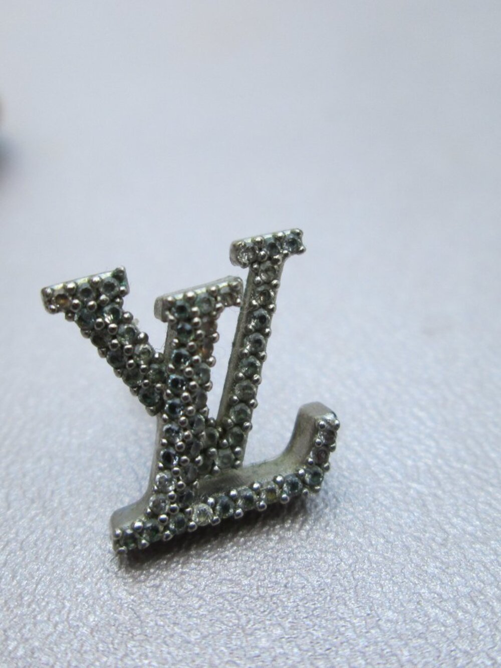 Authentic single Louis Vuitton LV Stud Logo Earrings
